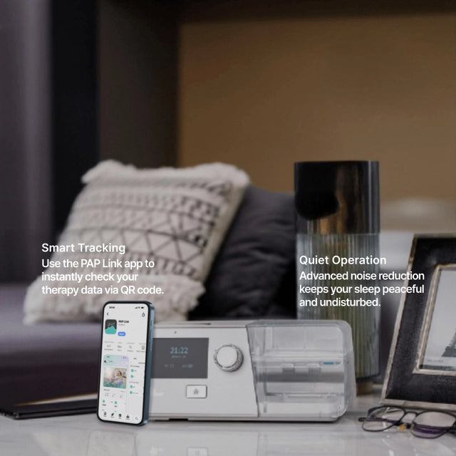 BMC G3 B30VT BiPAP with Humidifier on a nightstand next to a phone displaying PAP Link App