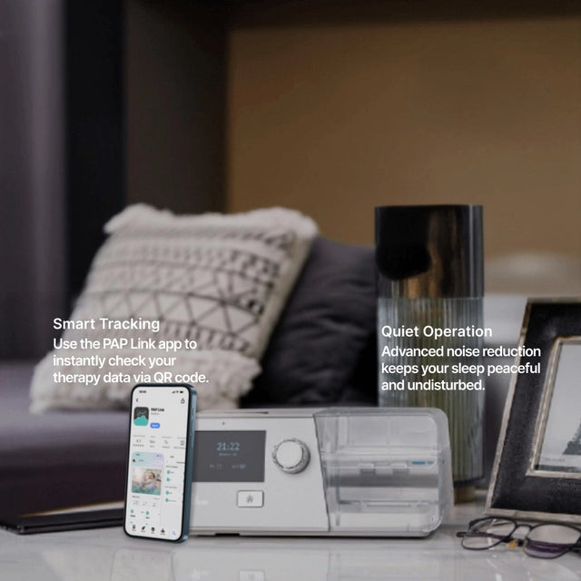 BMC G3 B25A BPAP with Humidifier on a nightstand next to a phone displaying PAP Link app