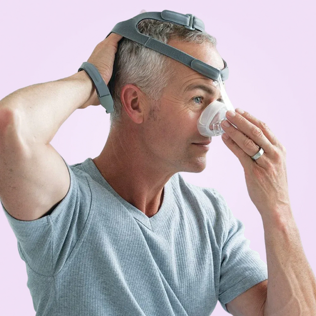 Man adjusting his Fisher & Paykel Eson Nasal CPAP Mask