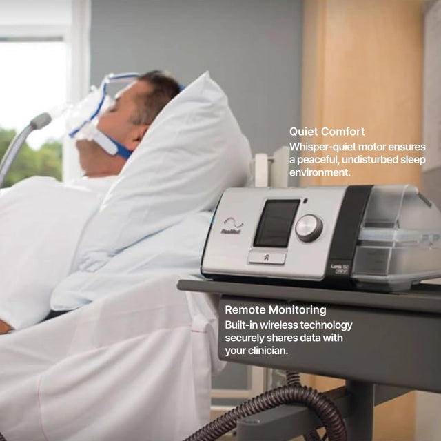 Man in bed on ResMed Lumis 150 VPAP ST Non-Invasive Ventilator