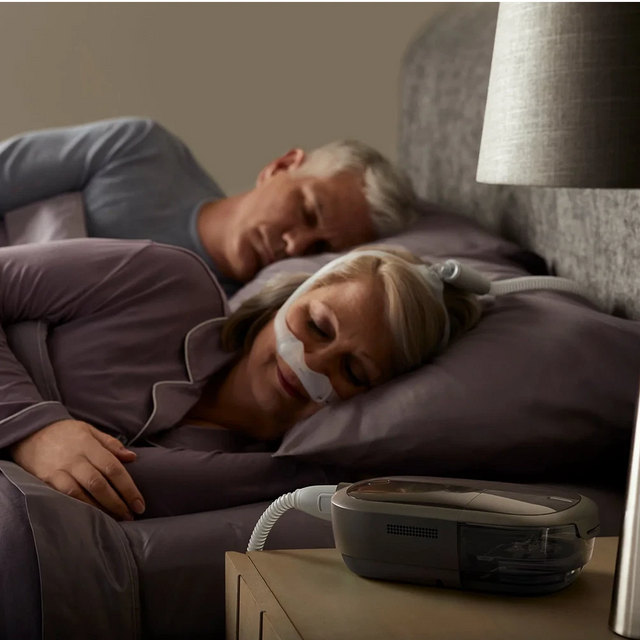 Woman using Philips Dreamstation 2 Auto CPAP while sleeping