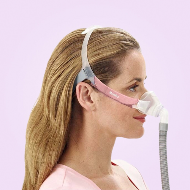Side view of a woman wearing the ResMed Swift FX Nano Nasal CPAP Mask For Her