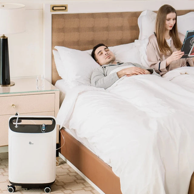 Man using BMC Oxygen Concentrator 5 LPM while in bed