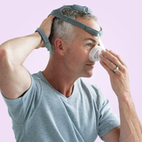 Man adjusting his Fisher & Paykel Eson Nasal CPAP Mask