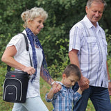 Woman using GCE Zen-O Portable Oxygen Concentrator while walking with a man and a kid