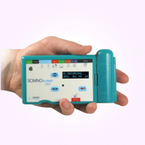 Hand holding SOMNOscreen™ Plus polysomnography (PSG) system