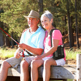 Woman using Inogen One G3 Portable Oxygen Concentrator while fishing with her partner