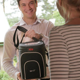 Man showing GCE Zen-O Portable Oxygen Concentrator in a bag