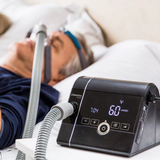 Person using Prisma SMART Auto CPAP Machine