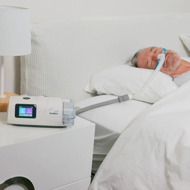 Man using ResMed AirCurve 11 S BiLevel Device during sleep