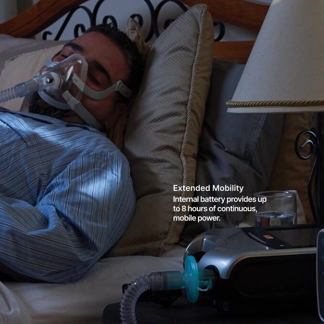 Man using ResMed Astral 150 Ventilator during sleep