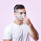 Person wearing a BMC F5A Full Face CPAP Mask against a pink background