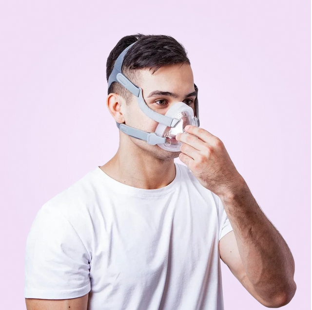 Person wearing a BMC F5A Full Face CPAP Mask against a pink background