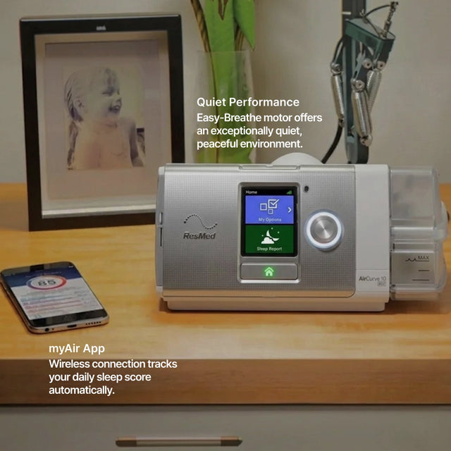 AirCurve 10 CS PaceWave Adaptive Servo-Ventilator with Humidifier on a nightstand next to a phone displaying the myAir App