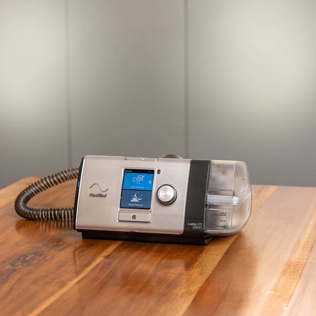 ResMed Lumis 100 VPAP ST Ventilator on a nightstand