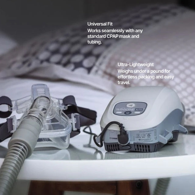 Transcend Auto Travel CPAP Machine on a nightstand next to a CPAP mask