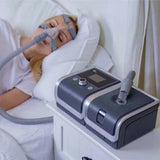Woman using RESmart GII Auto CPAP System