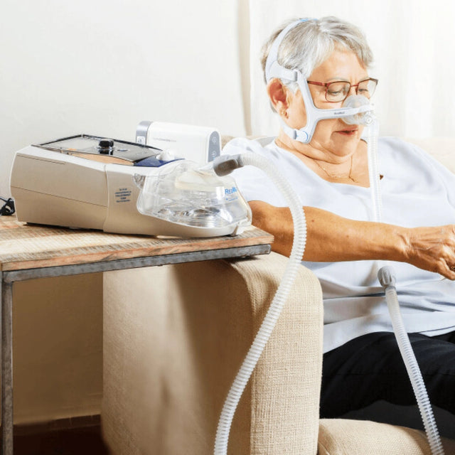 Woman using ResMed Stellar 150 Invasive & Non-invasive Ventilator